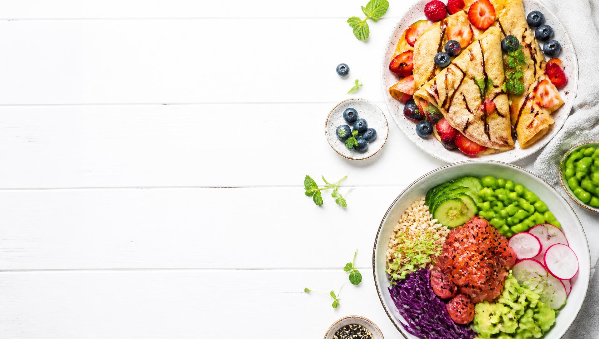 Fresh NDK crêpes with berries and a vibrant poke grain bowl