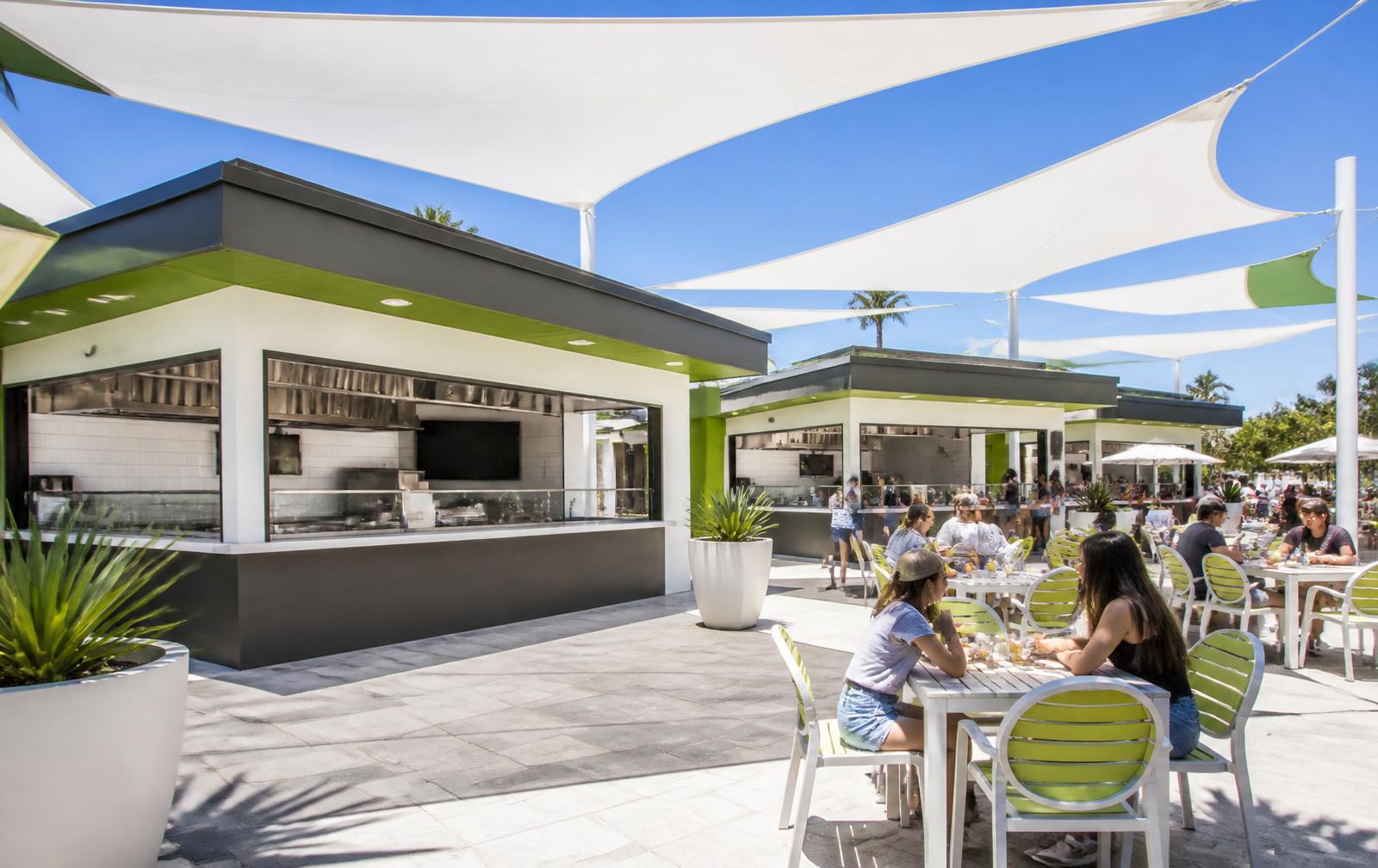 NDK Promenade outdoor kiosks with shaded guest seating