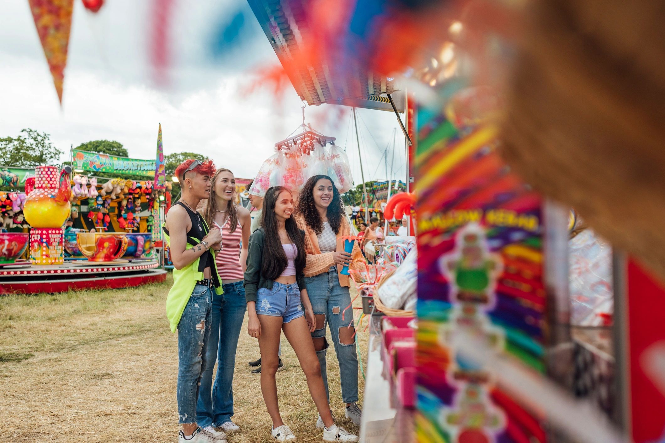 Guests purchasing food from a fairground concession stall