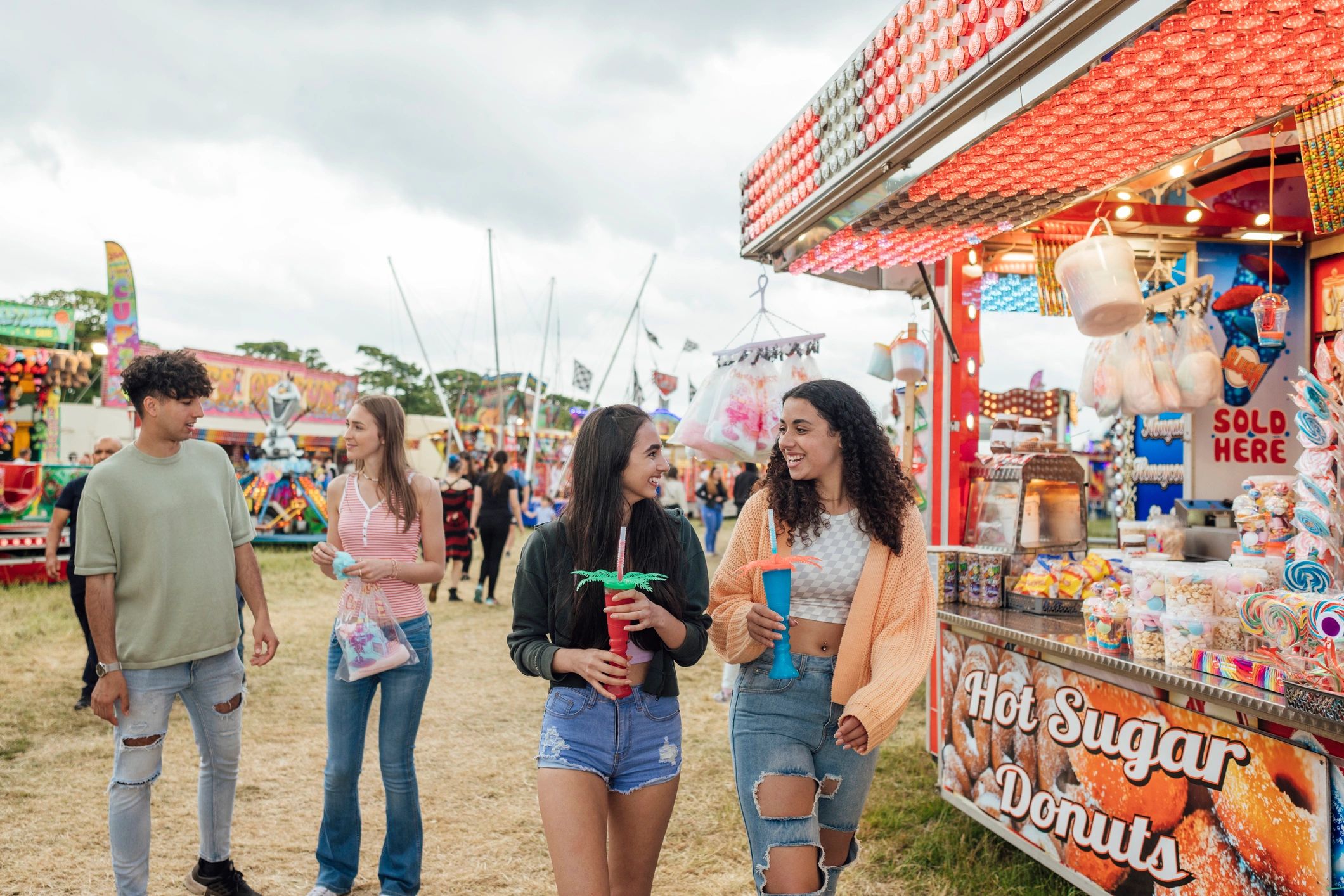 Guests enjoying food and drinks at a fairground event